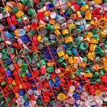 a large amount of plastic bottles in a cage